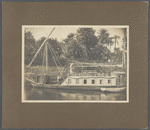 Ronald Firbank on a houseboat in Egypt, leaning on bannister of staircase
