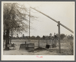 Well and mud vat for cooking sorghum syrup in front yard of Indians home near Summerville, South Carolina