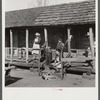 Indian (mixed breed) family on their front porch near Pembroke Farms. Maxton, North Carolina