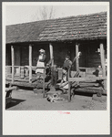 Indian (mixed breed) family on their front porch near Pembroke Farms. Maxton, North Carolina