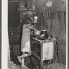 Oldest child of migrant packinghouse worker's family from Tennessee fixing supper. Her mother and father both work during the day and sometimes until two and three in the morning, leaving the children alone. Belle Glade, Florida