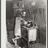 Oldest child of migrant packinghouse worker's family from Tennessee fixing supper. Her mother and father both work during the day and sometimes until two and three in the morning, leaving the children alone. Belle Glade, Florida