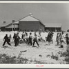 Second grade children playing near school building. Ashwood Plantations, South Carolina