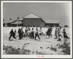 Second grade children playing near school building. Ashwood Plantations, South Carolina