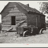 Deserted tenant farmer's shack and old car. Greene County, Georgia