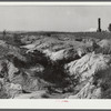 Soil erosion and remaining chimney of house. Greene County, Georgia
