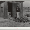Mrs. Brown's son and some of the chickens he raised. Inside poultry house can be seen part of the brooder he built. Prairie Farms, Alabama