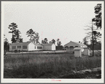 Community and school building, shop and sanitary units, rearview. Prairie Farms, Alabama