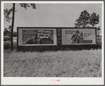 Highway signs by lumber planing mill. Cairo, Georgia