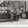 Testing motors of car in FSA (Farm Security Administration) warehouse depot. Atlanta, Georgia