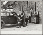 Testing motors of car in FSA (Farm Security Administration) warehouse depot. Atlanta, Georgia