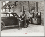Testing motors of car in FSA (Farm Security Administration) warehouse depot. Atlanta, Georgia