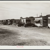Migratory laborers' camp. Single-room cabin costs two dollars and fifty cents, double room four dollars per week. Water hauled, usually priced at fifty-five cents for fifty-five gallon tank. Toilet for about 150 people. Near Belle Glade, Florida