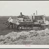 A whirling plough used by USSC (United States Sugar Corporation) in soft muck soil to prepare soil for planting sugarcane. Near Pahokee, Florida