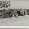 Migrant laborer's camp near packinghouse. Canal Point, Florida