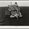 A whirling plough used by USSC (United States Sugar Corporation) in soft powdery muck soil to prepare soil for planting sugarcane. Near Pahokee, Florida