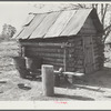 Smokehouse and washhouse built by rehabilitation family. Pike County, Alabama