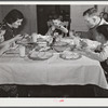 Helms family at dinner which consists of roast beef (home canned), turnip greens, potatoes, biscuits, corn bread, butter, milk, peaches, and cake. Coffee County, Alabama