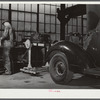 Repairing automobile motor. FSA (Farm Security Administration) warehouse depot. Atlanta, Georgia