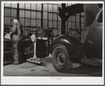 Repairing automobile motor. FSA (Farm Security Administration) warehouse depot. Atlanta, Georgia