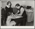 Miss Teal, nurse, and doctor W.R. Stanley giving young high school girl treatment in veneral disease clinic. Enterprise, Coffee County, Alabama