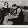Miss Teal, nurse, and doctor W.R. Stanley giving young high school girl treatment in veneral disease clinic. Enterprise, Coffee County, Alabama