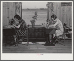 Jane McCutcheon and Ruth Lee Hear at sewing machines in home economics classroom. School building, Ashwood Plantations, South Carolina