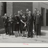 Group of speakers and guests with project manager Mr. Cathcart (at extreme left) on steps of auditorium after May Day-Health Day program at Ashwood Plantations, South Carolina