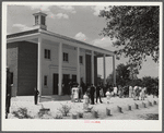 Project families, guests and schoolchildren leaving auditorium for picnic after May Day-Health Day program at Ashwood Plantations, South Carolina