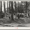 Project families, schoolchildren and guests enjoying barbecue sandwiches, hot dogs and coca colas, and ice cream after May Day-Health Day program. Irwinville Farms, Georgia
