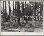 Project families, schoolchildren and guests enjoying barbecue sandwiches, hot dogs and coca colas, and ice cream after May Day-Health Day program. Irwinville Farms, Georgia
