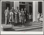 Group on steps of community auditorium with county doctor, project manager and nurse on May Day-Health Day program. Irwinville Farms, Georgia