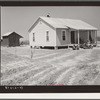 New home and smokehouse of Charles McGuire (tenant purchase borrower) with his wife and children on front porch. Pike County, Alabama