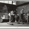 Repairing automobile motor at FSA (Farm Security Administration) warehouse depot. Atlanta, Georgia