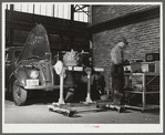Repairing automobile motor at FSA (Farm Security Administration) warehouse depot. Atlanta, Georgia