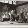 Repairing automobile motor at FSA (Farm Security Administration) warehouse depot. Atlanta, Georgia