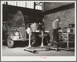 Repairing automobile motor at FSA (Farm Security Administration) warehouse depot. Atlanta, Georgia
