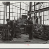 Repairing tractor. FSA (Farm Security Administration) warehouse depot. Atlanta, Georgia