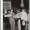 Farmer buying baby chicks, Farmers' exchange, Enterprise, Alabama
