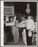 Farmer buying baby chicks, Farmers' exchange, Enterprise, Alabama
