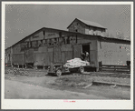 Loading truck with feed and fertilizer. Enterprise, Coffee County, Alabama