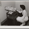 Weighing baby at medical center. Greenbelt, Maryland