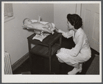 Weighing baby at medical center. Greenbelt, Maryland