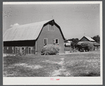 Stock barn with wagon and truck of hay on a very prosperous farm, over 600 acres, belonging to a Black farmer B.C. Corbett. This is a Black settlement. Near Carr, in Orange County, North Carolina