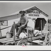 Combination filling station, garage, blacksmith shop, grocery store. Frank Petty, owner of the wagon, has just had his mule shod, his corn ground, purchases some kerosene and is returning home. R.F.D. Danville, Virginia, Pittsylvania County
