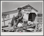 Combination filling station, garage, blacksmith shop, grocery store. Frank Petty, owner of the wagon, has just had his mule shod, his corn ground, purchases some kerosene and is returning home. R.F.D. Danville, Virginia, Pittsylvania County