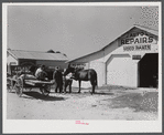 Combination filling station, garage, blacksmith shop, grocery store. Frank Petty, owner of the wagon, has just had his mule shod, his corn ground, purchases some kerosene and is returning home. R.F.D. Danville, Virginia, Pittsylvania County