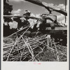 Feeding the sorghum cane into the mill to make syrup on property of Wes Chris, a tobacco farm of about 165 acres in a prosperous Black settlement near Carr, Orange County, North Carolina