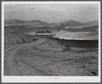 Train bringing copper ore out of mine. Ducktown, Tennessee. Fumes from smelting copper for sulfuric acid have destroyed all vegetation and eroded the land