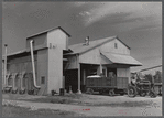 Modern gin and dryer with cotton brought in from fields by a tractor pulling large truck instead of smaller wagons. Truck holds eight bales of cotton. Hopson Plantation, near Clarksdale. Mississippi Delta, Mississippi